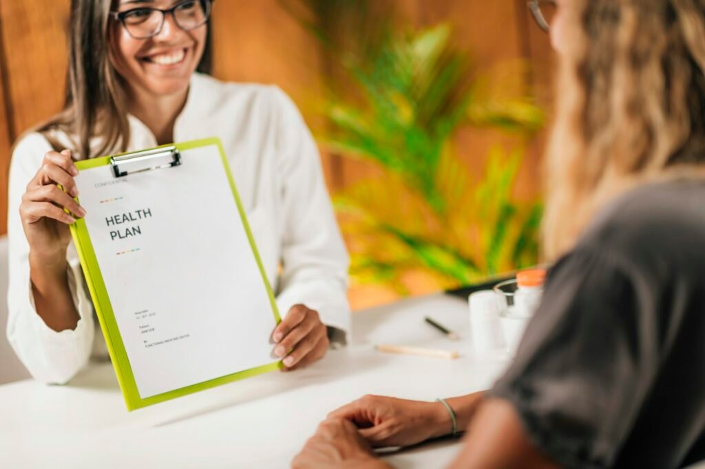 Preventive Healthcare Professional Handing a Personalized Health Plan to a Client